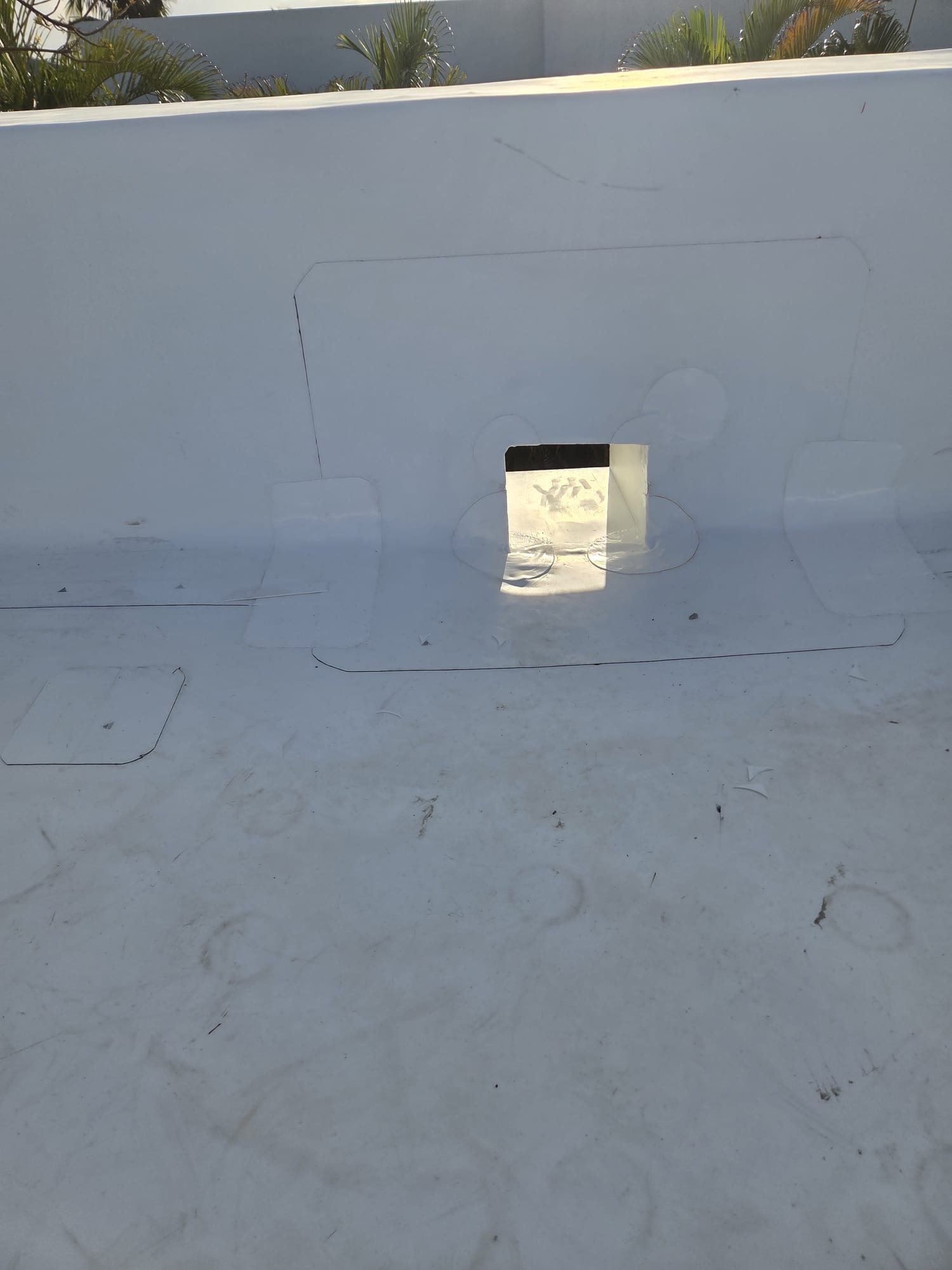 Detail of membrane flashing at a roof scupper