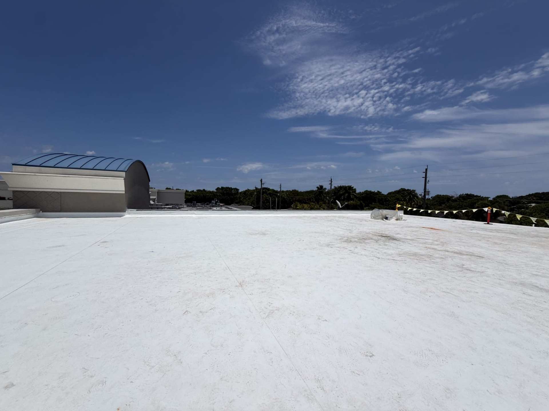 Large commercial white flat roof completed